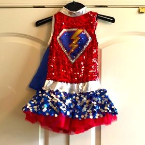 Super hero costume with removable cape, mask and wrist cuffs.